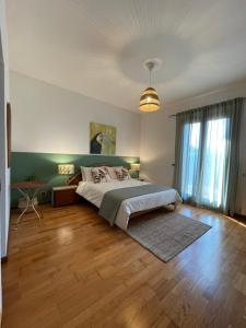 Un pat sau paturi într-o cameră la Villa Marinella Apartment - Locazione Turistica