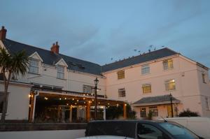 a building with a car parked in front of it at The Cornishman Inn in Tintagel
