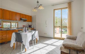 a kitchen with a table with a white table cloth at Casa Marinella in Castelvetrano Selinunte