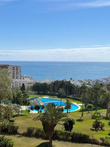 a view of a swimming pool with the ocean in the background at Minerva in Benalmádena