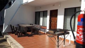 a patio with a table and chairs on a house at Villa Mia Holiday Flats no 7 in St Lucia