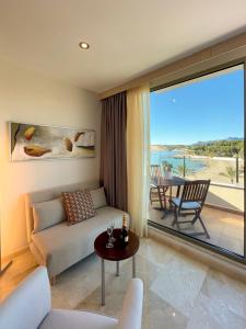 a living room with a couch and a table at La Sort Boutique Hotel in Moraira