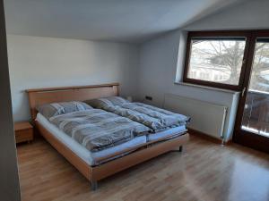 Postel nebo postele na pokoji v ubytování Ferienwohnung Appartement Am Schilf XL