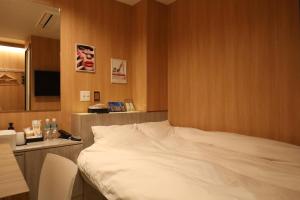 Postel nebo postele na pokoji v ubytování Hotel Charire Kichijoji + 13 fotografií