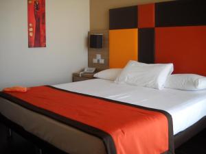 Postel nebo postele na pokoji v ubytování Hotel Tiber Rooftop & Wellness