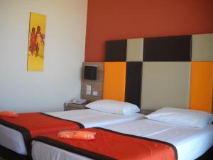 Postel nebo postele na pokoji v ubytování Hotel Tiber Rooftop & Wellness