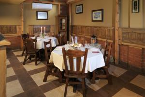 a dining room with tables and chairs in a restaurant at WHITE HOUSE Plovdiv in Plovdiv