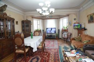 a living room with a table and a couch at Norik's Guest House in Sevan