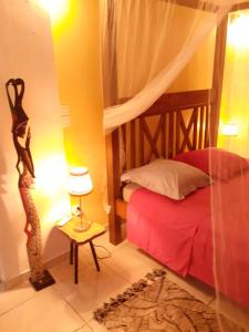 Ένα ή περισσότερα κρεβάτια σε δωμάτιο στο CHEZ COCO appartement BALISIER