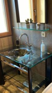 a bathroom counter with a sink and a mirror at Casa El Descanso Ortigosa del Monte in Ortigosa del Monte