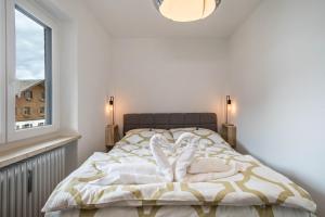 Postel nebo postele na pokoji v ubytování Allgäu SPA House