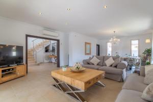 a living room with a couch and a table at Cala Ratjada - 3818-01 Mallorca in Cala Ratjada