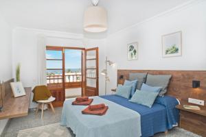 A bed or beds in a room at Villa Pilar