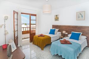 A bed or beds in a room at Villa Pilar