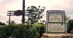 a sign for a welcome to restore and a sign for a restaurant at Dover Cottage in Nuwara Eliya