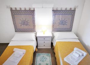 Postel nebo postele na pokoji v ubytování Residenza Pierre et Vacances Badus