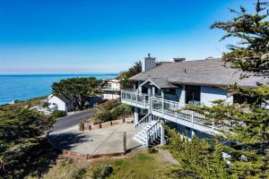 an aerial view of a house overlooking the ocean at Whale Watch FANTASTIC VIEWS Game Room Dog Friendly in Dillon Beach