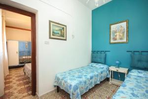 Postel nebo postele na pokoji v ubytování Casa Buscarini