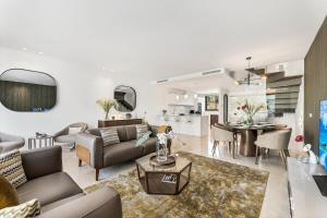 a living room with a couch and a table at Oasis by the Sea in La Cala de Mijas (La Valvega) in Mijas Costa