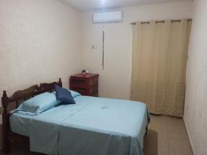 Una cama o camas en una habitación de Casita Mahahual, Grand Costa Maya