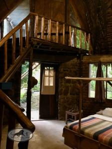 a bedroom with a bunk bed in a log cabin at Baker Safari Company in Kwangwazi