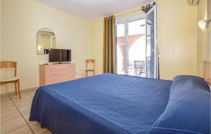 Ένα ή περισσότερα κρεβάτια σε δωμάτιο στο Cozy Apartment In Propriano With Wifi