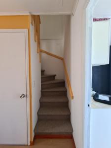 Una televisión o centro de entretenimiento en Casa Rucapillan Villarrica