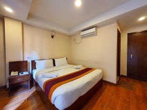 Postel nebo postele na pokoji v ubytování Hotel Everest Nepal + 24 fotografií