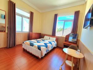 Postel nebo postele na pokoji v ubytování Đông Đức Hostel Đà Lạt