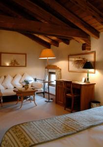 A bed or beds in a room at Hotel L'Ultimo Mulino