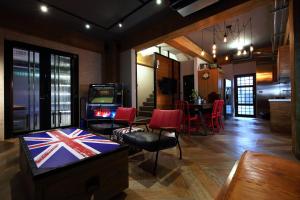 a living room with a video game and a table at Ji Ye Jing Zhan B&B in Ji'an