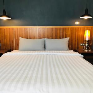 Łóżko lub łóżka w pokoju w obiekcie Kenting Cozy B&B