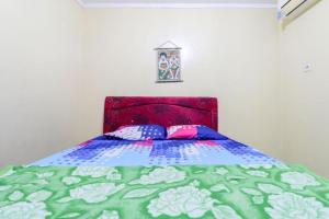 Postel nebo postele na pokoji v ubytování Cempaka Hotel