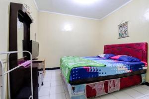 Postel nebo postele na pokoji v ubytování Cempaka Hotel