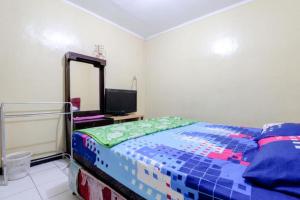 Postel nebo postele na pokoji v ubytování Cempaka Hotel