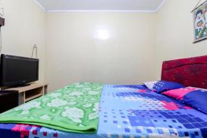 Postel nebo postele na pokoji v ubytování Cempaka Hotel