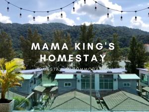 a view of a house with a mountain in the background at Mama King's Homestay @ Marina Island in Kampong Batu Gajah