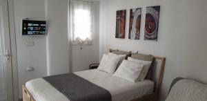 Postel nebo postele na pokoji v ubytování La Playa Studio Mykonos
