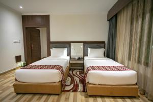 Voodi või voodid majutusasutuse Hotel Starlight toas