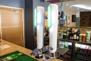 a bar with two lights on a counter at Eurotraveller Hotel - Premier - Tower Bridge in London