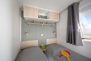 Postel nebo postele na pokoji v ubytování Camping la Simioune en Provence