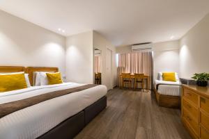 Postel nebo postele na pokoji v ubytování Melio Hotel Eilat