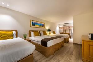 Postel nebo postele na pokoji v ubytování Melio Hotel Eilat