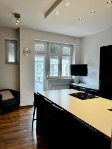 a kitchen with a counter top and a stove at Apartament 52 City Center in Gdynia