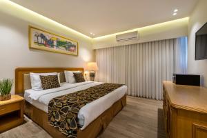TV a/nebo společenská místnost v ubytování Melio Hotel Eilat