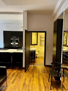 Televízia a/alebo spoločenská miestnosť v ubytovaní Apartament 52 City Center