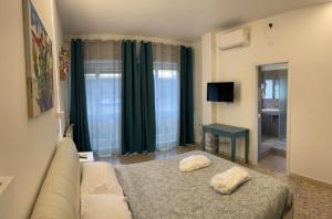 Posteľ alebo postele v izbe v ubytovaní Catania Apartment Borgo Suite Autonomous