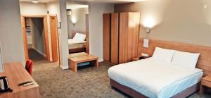 a hotel room with a bed and a small bedroom at Silivri Park Hotel in Silivri