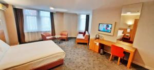 a hotel room with a bed and a desk at Silivri Park Hotel in Silivri