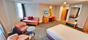 a hotel room with a bed and a desk at Silivri Park Hotel in Silivri
